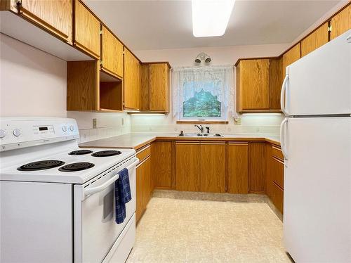 76 Centennial Drive, Onanole, MB - Indoor Photo Showing Kitchen With Double Sink