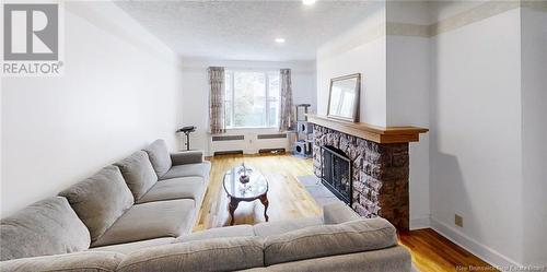 11 Charles Street, Sackville, NB - Indoor Photo Showing Living Room With Fireplace