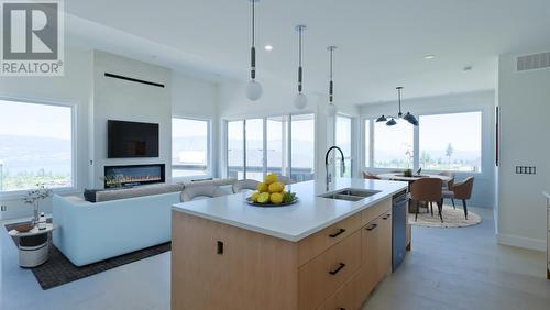 402 Trestle Ridge Drive, Kelowna, BC - Indoor Photo Showing Kitchen With Fireplace With Double Sink With Upgraded Kitchen