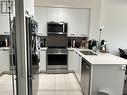 1411 - 35 Watergarden Drive, Mississauga, ON  - Indoor Photo Showing Kitchen With Double Sink 