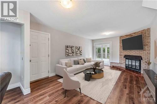 virtually staged photo - 26 Fortune Street, Richmond, ON - Indoor Photo Showing Living Room With Fireplace