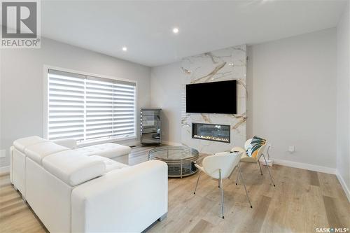 255 Flynn Cove, Saskatoon, SK - Indoor Photo Showing Living Room With Fireplace