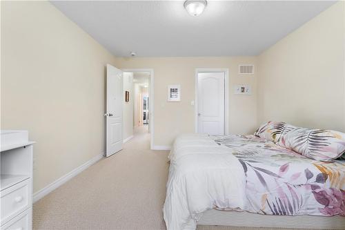 Primary Bedroom with Walk in Closet - 4456 Saw Mill Drive, Niagara Falls, ON - Indoor Photo Showing Bedroom