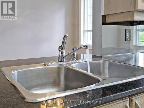 105 - 388 Prince Of Wales Drive, Mississauga (City Centre), ON - Indoor Photo Showing Kitchen With Double Sink