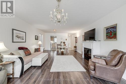 10 - 222 Steel Street, Barrie (Grove East), ON - Indoor Photo Showing Living Room With Fireplace