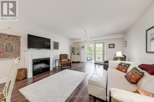 10 - 222 Steel Street, Barrie (Grove East), ON - Indoor Photo Showing Living Room With Fireplace