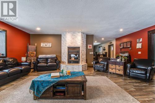 26 Byers Road, Cherryville, BC - Indoor Photo Showing Living Room With Fireplace