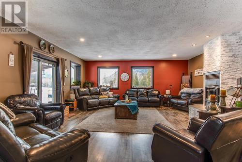 26 Byers Road, Cherryville, BC - Indoor Photo Showing Living Room With Fireplace