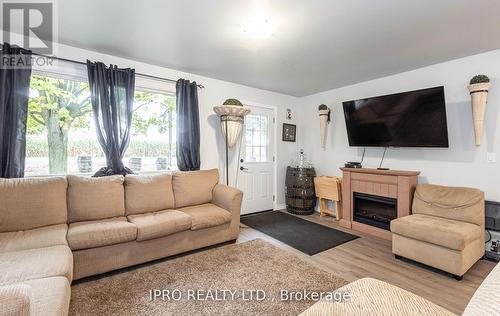 44485 Brandon Road, Huron East, ON - Indoor Photo Showing Living Room With Fireplace