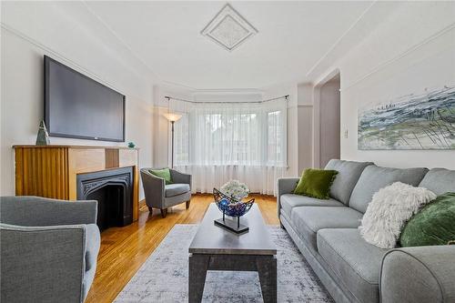 24 Thorndale Street N, Hamilton, ON - Indoor Photo Showing Living Room With Fireplace