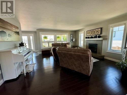 1832 86 Avenue, Dawson Creek, BC - Indoor Photo Showing Living Room With Fireplace