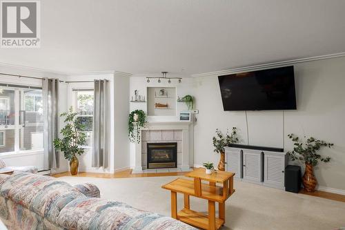 315 Whitman Road Unit# 205, Kelowna, BC - Indoor Photo Showing Living Room With Fireplace