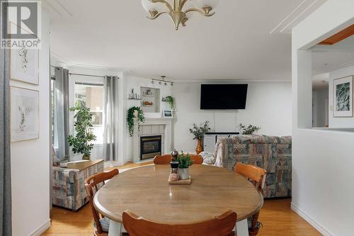 315 Whitman Road Unit# 205, Kelowna, BC - Indoor Photo Showing Dining Room With Fireplace