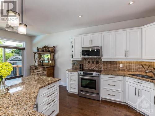 Watch the fun in the pool while your prepping dinner. - 50 Frances Colbert Avenue, Ottawa, ON - Indoor Photo Showing Kitchen With Upgraded Kitchen