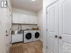 Main Floor laundry/ mud room/pantry conveniently located off the garage inside entrance. - 