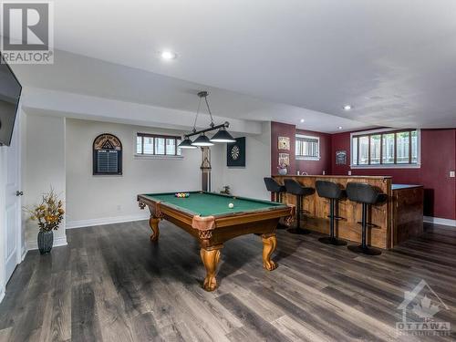 Beautiful Rec Room perfect size for a pool table and complete with wet bar. Note new flooring being installed. - 50 Frances Colbert Avenue, Ottawa, ON - Indoor Photo Showing Other Room