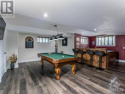 Beautiful Rec Room perfect size for a pool table and complete with wet bar. Note new flooring being installed. - 