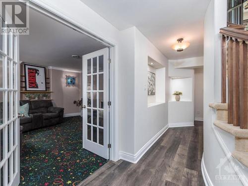 Fantastic Home theatre room wired for surround sound and mood lighting. Note new flooring being installed. - 50 Frances Colbert Avenue, Ottawa, ON - Indoor Photo Showing Other Room