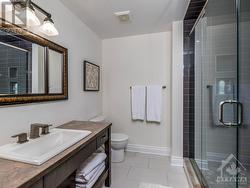 Lower level Bathroom with full size shower stall. - 