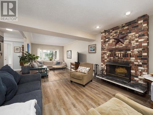 8025 Newcastle Crescent, Prince George, BC - Indoor Photo Showing Living Room With Fireplace