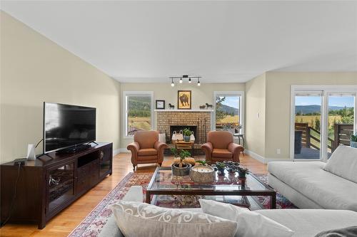 1258 Round Lake Road, Spallumcheen, BC - Indoor Photo Showing Living Room With Fireplace