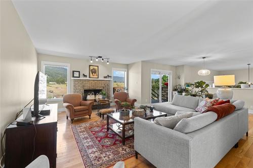 1258 Round Lake Road, Spallumcheen, BC - Indoor Photo Showing Living Room With Fireplace