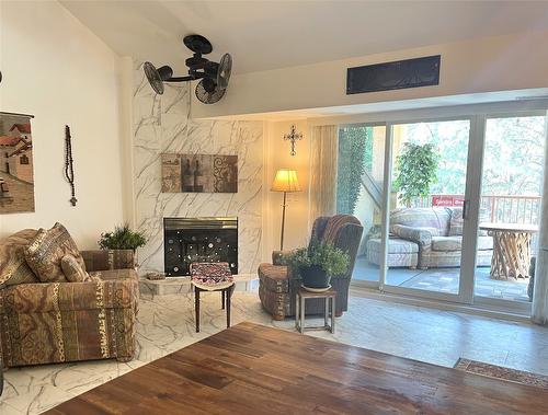 203-3179 Via Centrale Road, Kelowna, BC - Indoor Photo Showing Living Room With Fireplace