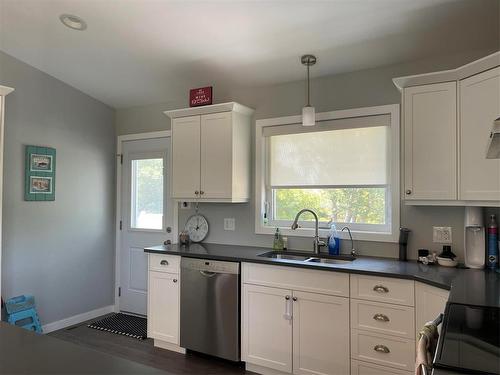 430 Currie Road, Swan River, MB - Indoor Photo Showing Kitchen With Double Sink