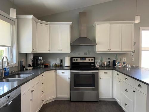 430 Currie Road, Swan River, MB - Indoor Photo Showing Kitchen With Double Sink