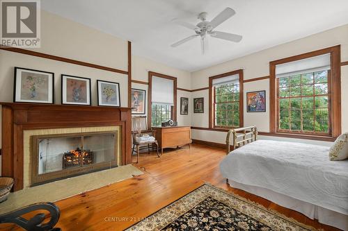 72 County Road 24, Prince Edward County (Athol), ON - Indoor Photo Showing Bedroom With Fireplace