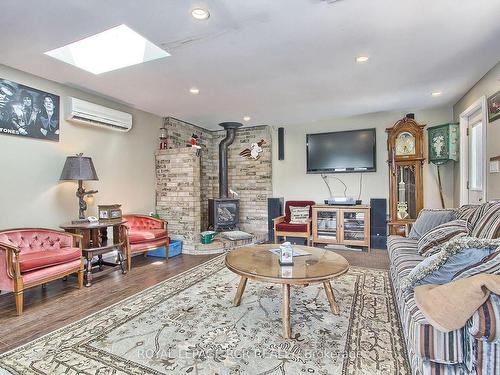 228 Bayshore Rd E, Innisfil, ON - Indoor Photo Showing Living Room With Fireplace