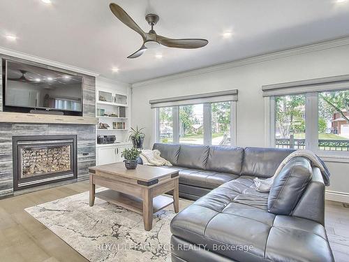 228 Bayshore Rd E, Innisfil, ON - Indoor Photo Showing Living Room With Fireplace