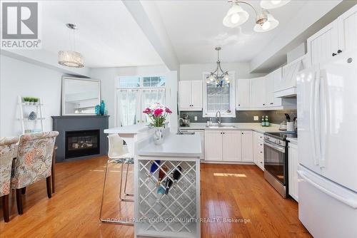 979 Lake Drive E, Georgina (Sutton & Jackson'S Point), ON - Indoor Photo Showing Kitchen With Fireplace