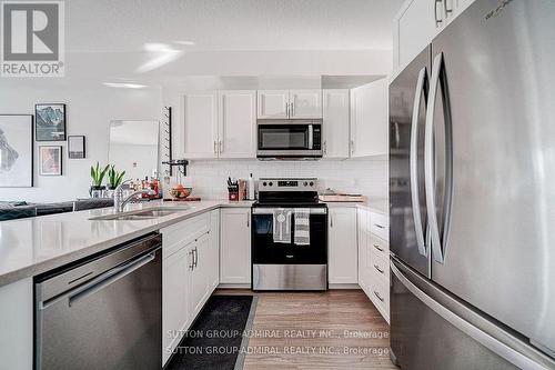 301 - 2605 Binbrook Road, Hamilton (Binbrook), ON - Indoor Photo Showing Kitchen With Stainless Steel Kitchen With Double Sink With Upgraded Kitchen