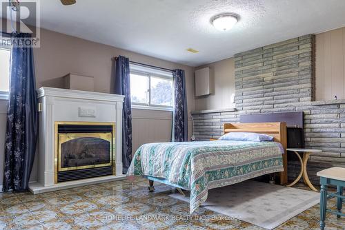 6776 Margaret Street, Niagara Falls, ON - Indoor Photo Showing Bedroom With Fireplace