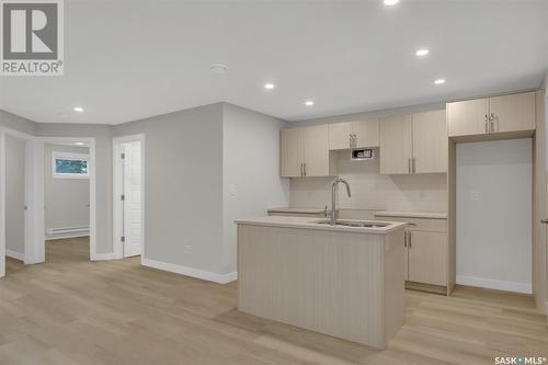 243 St John Street, Regina, SK - Indoor Photo Showing Kitchen With Double Sink