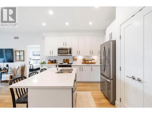 3434 Mckinley Beach Drive Unit# 407, Kelowna, BC - Indoor Photo Showing Kitchen With Double Sink With Upgraded Kitchen