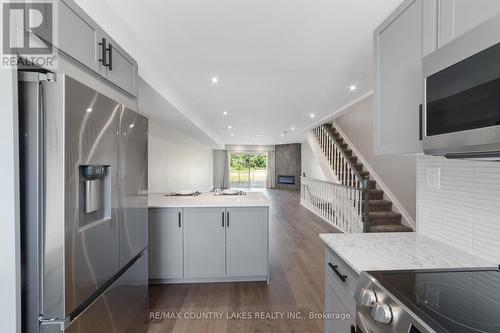 22 - 100 Laguna Parkway, Ramara (Brechin), ON - Indoor Photo Showing Kitchen