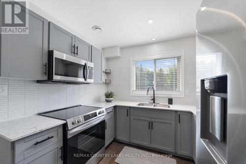 22 - 100 Laguna Parkway, Ramara (Brechin), ON - Indoor Photo Showing Kitchen With Double Sink With Upgraded Kitchen