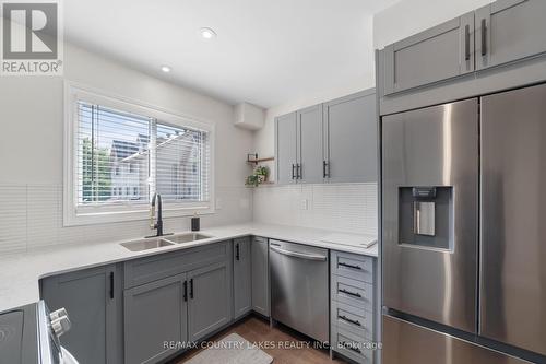 22 - 100 Laguna Parkway, Ramara (Brechin), ON - Indoor Photo Showing Kitchen With Double Sink