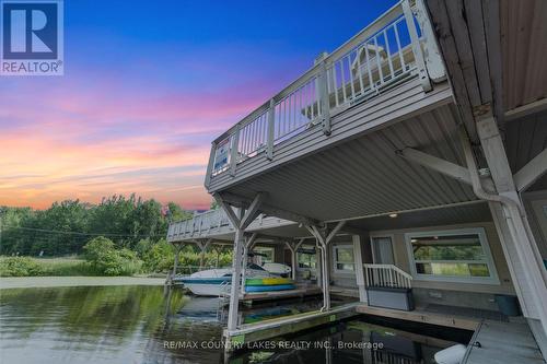 22 - 100 Laguna Parkway, Ramara (Brechin), ON - Outdoor With Body Of Water With Deck Patio Veranda