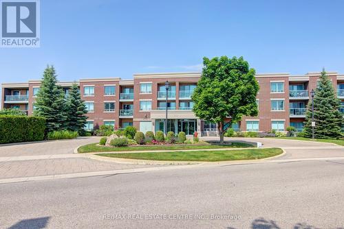 317 - 55 Via Rosedale, Brampton (Sandringham-Wellington), ON - Outdoor With Balcony With Facade