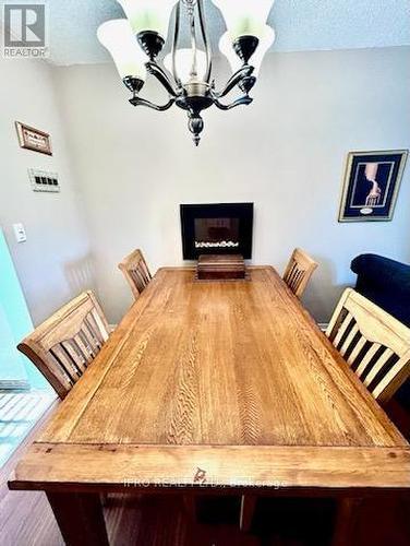 24 - 65 Dorchester Boulevard, St. Catharines, ON - Indoor Photo Showing Dining Room With Fireplace