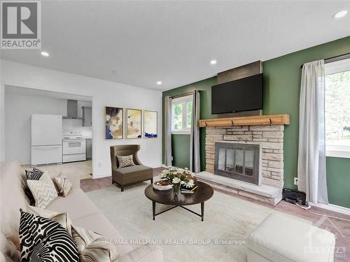 8692 Bank Street, Ottawa, ON - Indoor Photo Showing Living Room With Fireplace