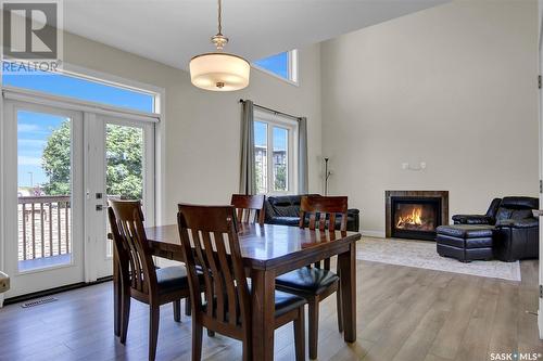 5389 Mckenna Crescent, Regina, SK - Indoor Photo Showing Dining Room With Fireplace