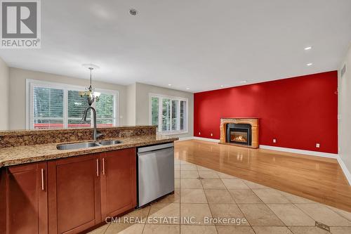 88 41St Street S, Wasaga Beach, ON - Indoor Photo Showing Kitchen With Fireplace With Double Sink