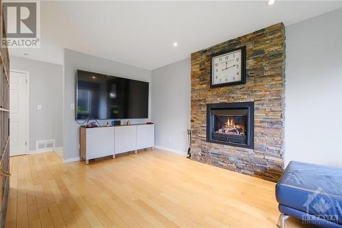 Main floor family room with gas fireplace. - 746 Hauteview Crescent, Ottawa, ON - Indoor Photo Showing Living Room With Fireplace