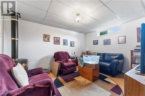 Cozy lower level rec room with gas stove. - 99 Ivy Avenue, Renfrew, ON - Indoor