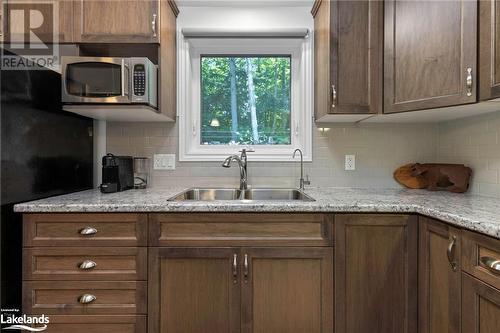 411 Shawanaga Lake Road, Dunchurch, ON - Indoor Photo Showing Kitchen With Double Sink