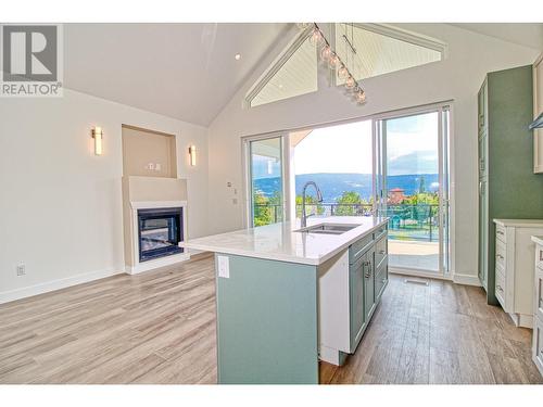 6857 Madrid Way Unit# 336, Kelowna, BC - Indoor Photo Showing Kitchen With Fireplace With Double Sink